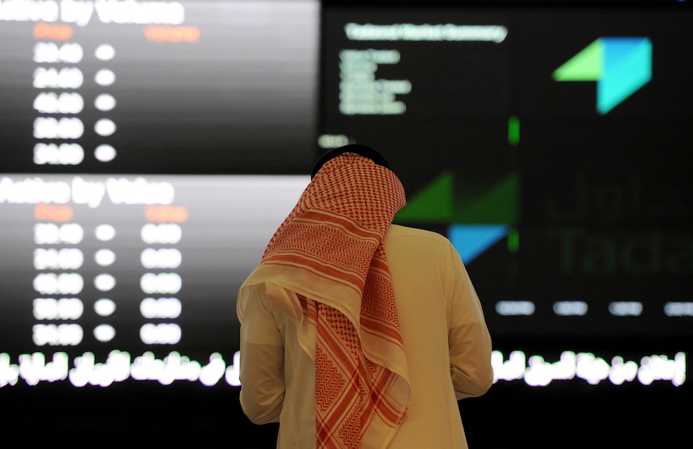 A Saudi investor monitors stock prices at the Saudi Stock Exchange, or Tadawul, in the Saudi capital, Riyadh. File/AFP