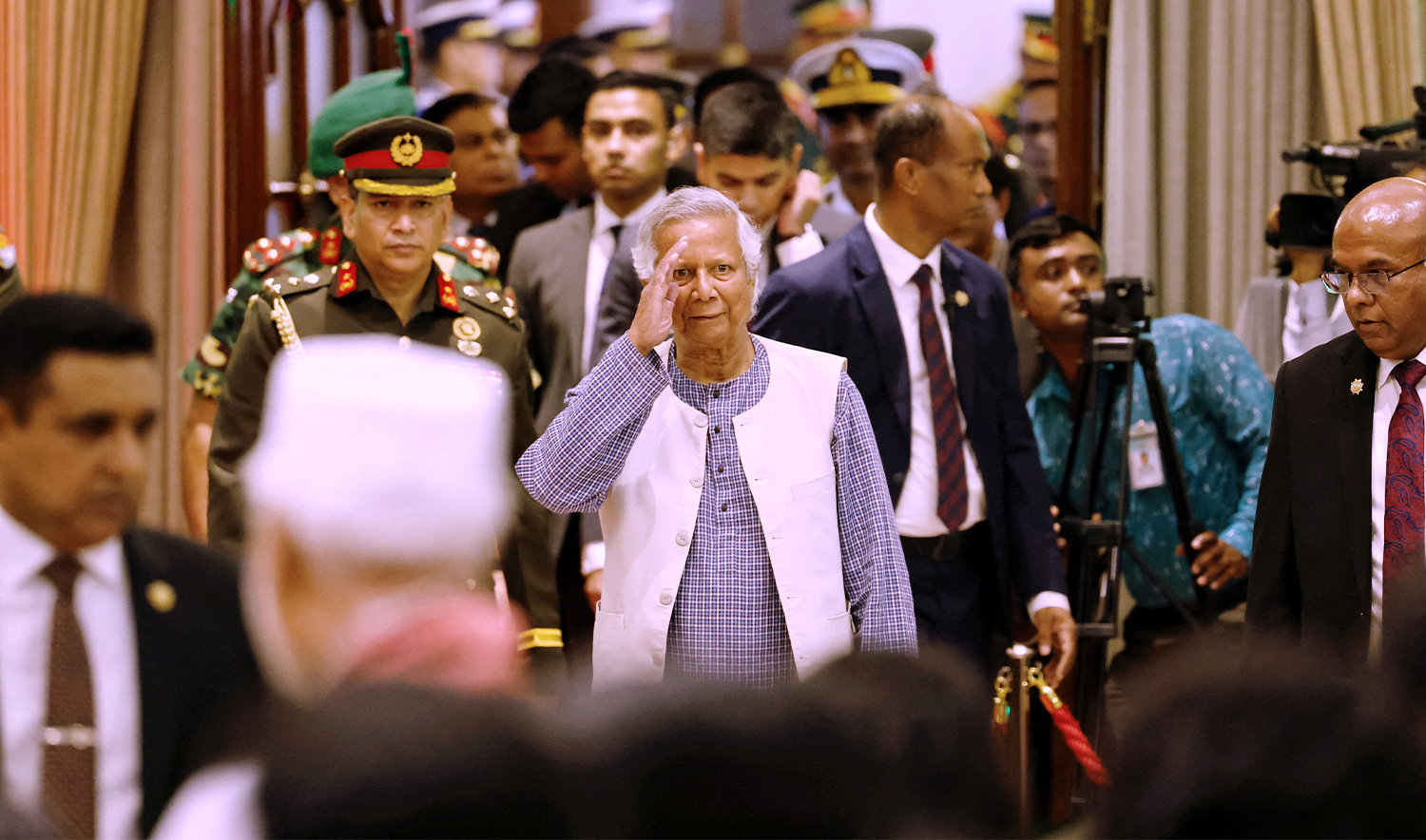 Nobel laureate Muhammad Yunus salutes to the attendees upon arrival at the Bangabhaban to take oath as the head of the interim government, in Dhaka, Bangladesh, on August 8, 2024. (REUTER/File)