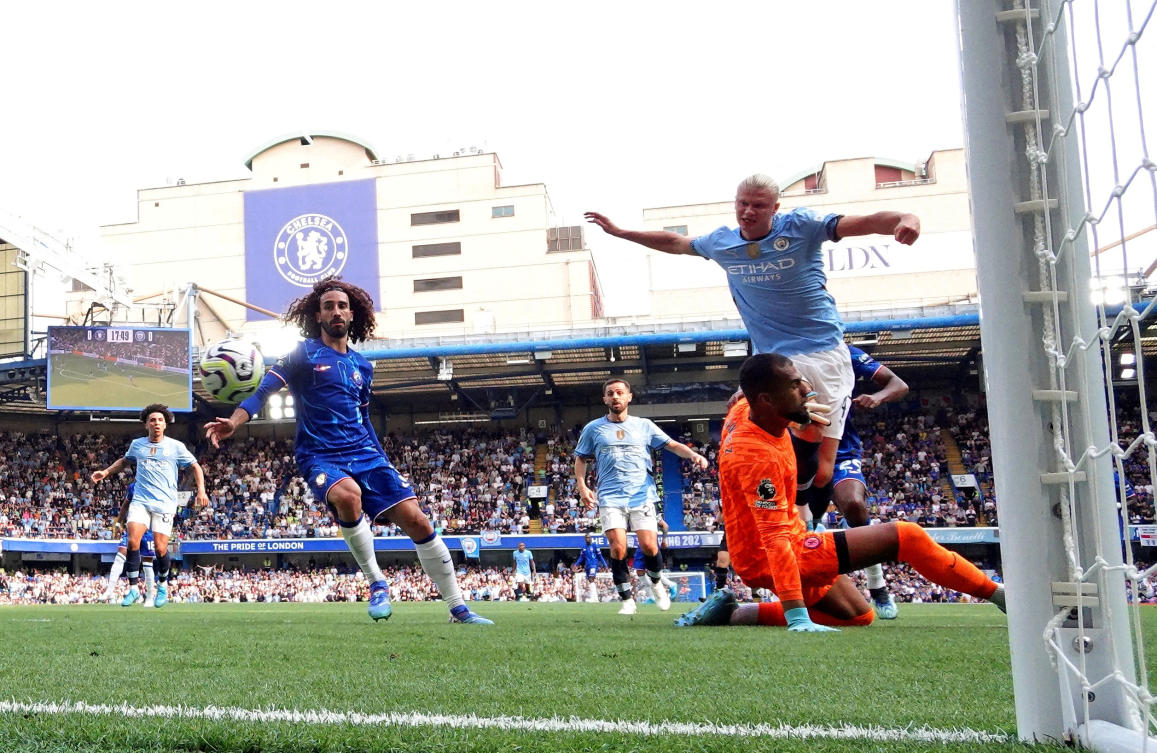 Manchester City’s Erling Haaland scores their first goal against Chelsea at Stamford Bridge in their Premier League opener. (Reuters)