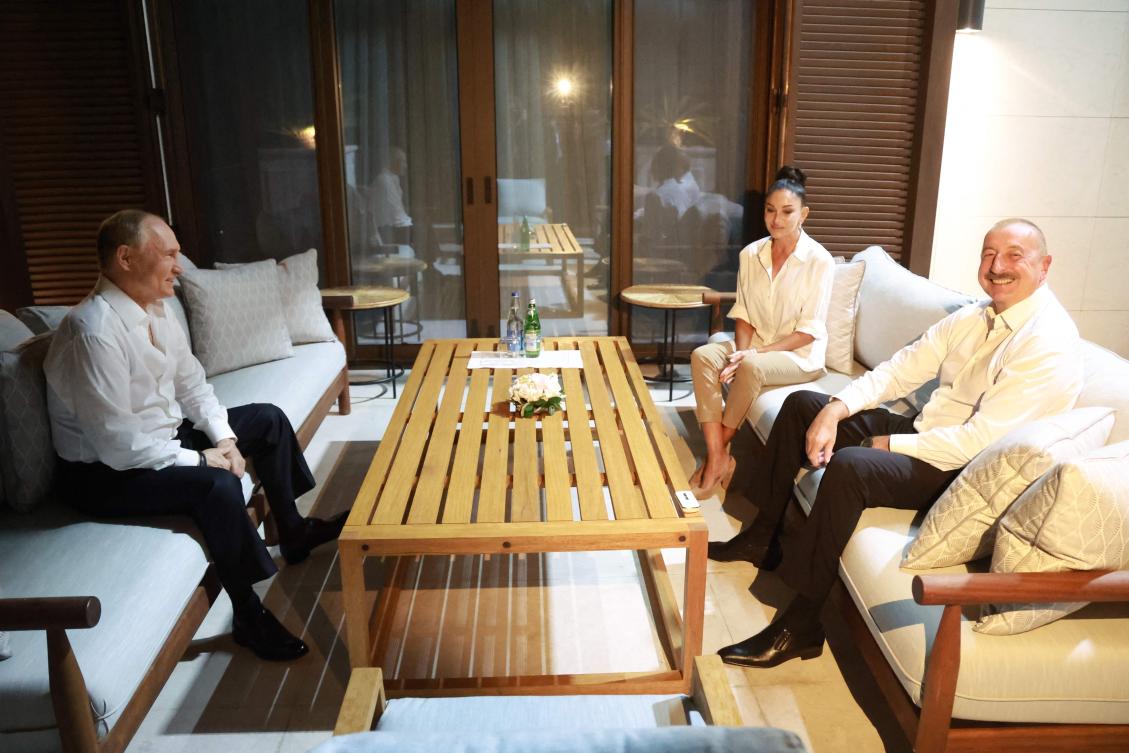 Azerbaijan’s President Ilham Aliyev (R) and his wife Mehriban Aliyeva (C) meet with Russia’s President Vladimir Putin at their home in Baku on August 18, 2024. (AFP)