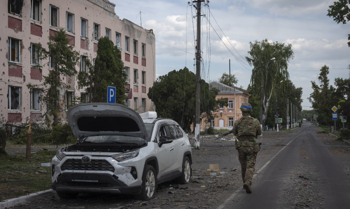 A Ukrainian soldier walks past at a city hall in Sudzha, Kursk region, Russia, Aug. 16, 2024. (AP)