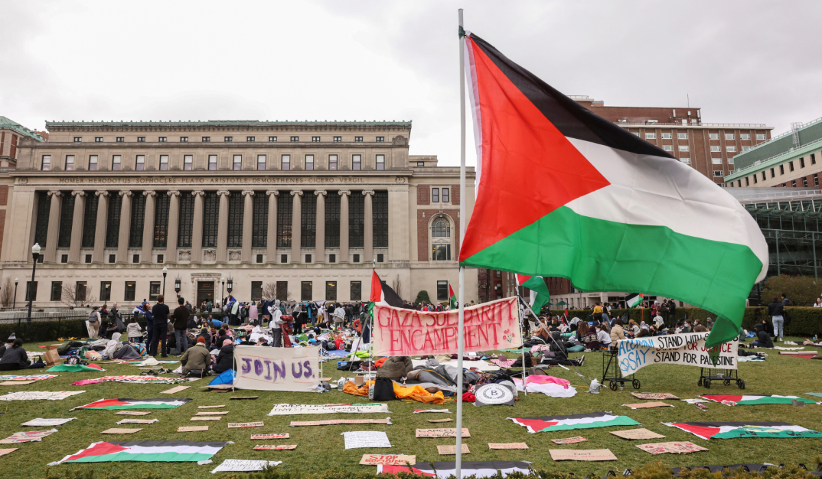 Demonstrators sit in an encampment as they protest in solidarity with Pro-Palestinian organizers on the Columbia University campus, amid the ongoing conflict between Israel and the Palestinian Islamist group Hamas, in New York City, U.S., April 19, 2024. (REUTERS)