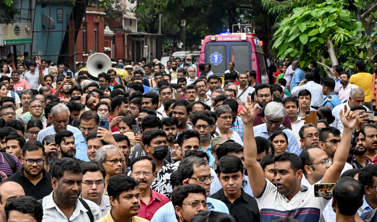 Medical professionals stage a protest to condemn the rape and murder of a doctor, at the Calcutta Medical College and Hospital in Kolkata on August 19, 2024. (AFP)