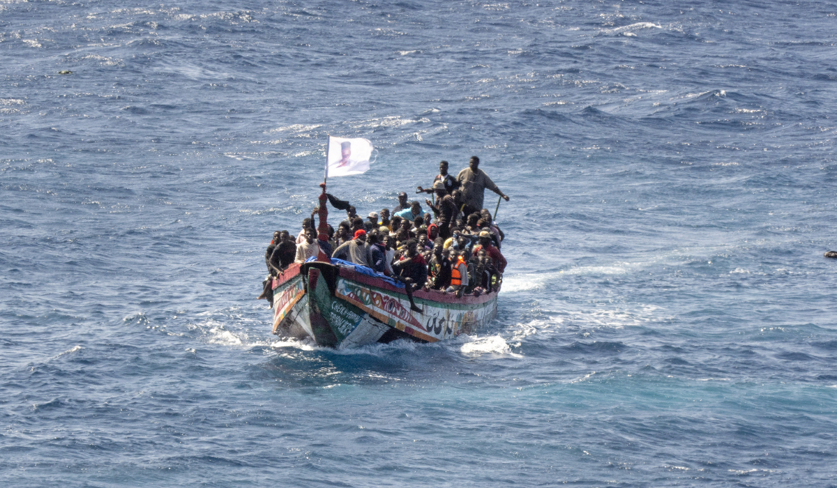 Migrants crowd a wooden boat as they sail to the port in La Restinga on the Canary island of El Hierro, Spain, Sunday, Aug. 18, 2024. (AP)