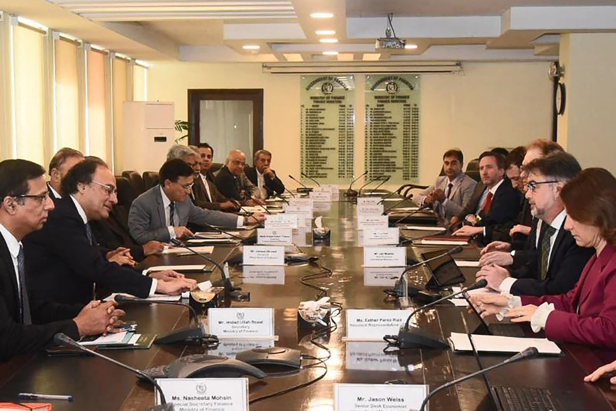 Photo taken on March 14, 2024, Pakistan’s Finance Minister Muhammad Aurangzeb (2L) speaks with International Monetary Fund (IMF) Mission Chief for Pakistan Nathan Porter (2R) during a meeting in Islamabad.(AFP)