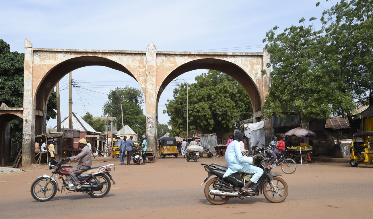 Motor bike riders drive past Kofar Kade, a city gate in ancient Sokoto, northwest Nigeria on September 21, 2021. (AFP/File)
