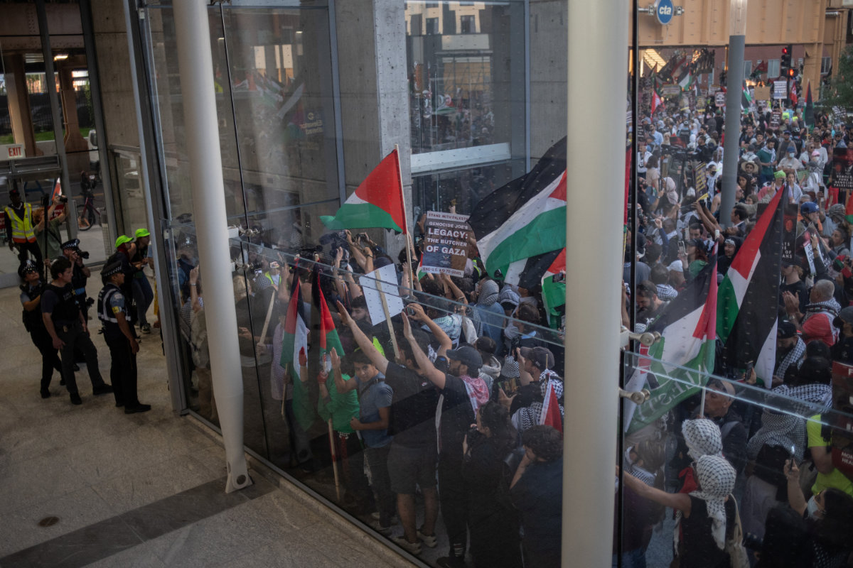 Protesters taking part in a pro-Palestinian march demanding the release of two women wearing hijab who were detained by police on the Damen train station platform, along the sidelines of the Democratic National Convention, in Chicago on August 21, 2024. (REUTERS)
