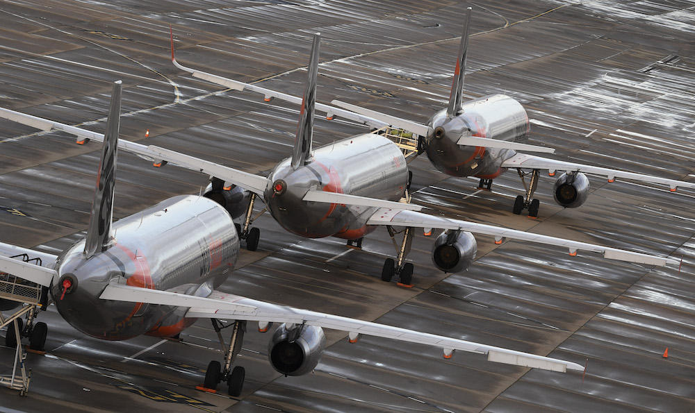 Jetstar Flight JQ507 had arrived in Melbourne from Sydney when the incident happened. Above, Jetstar planes sit on the tarmac at Melbourne’s Tullamarine Airport on April 12, 2020. (AFP file photo)