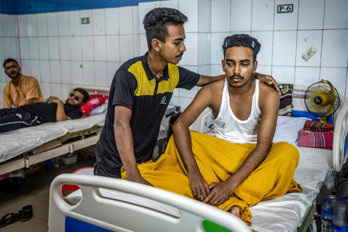 At least two people have died and hundreds of thousands are stranded in the floods in at least eight districts. (Photo by LUIS TATO / AFP)
