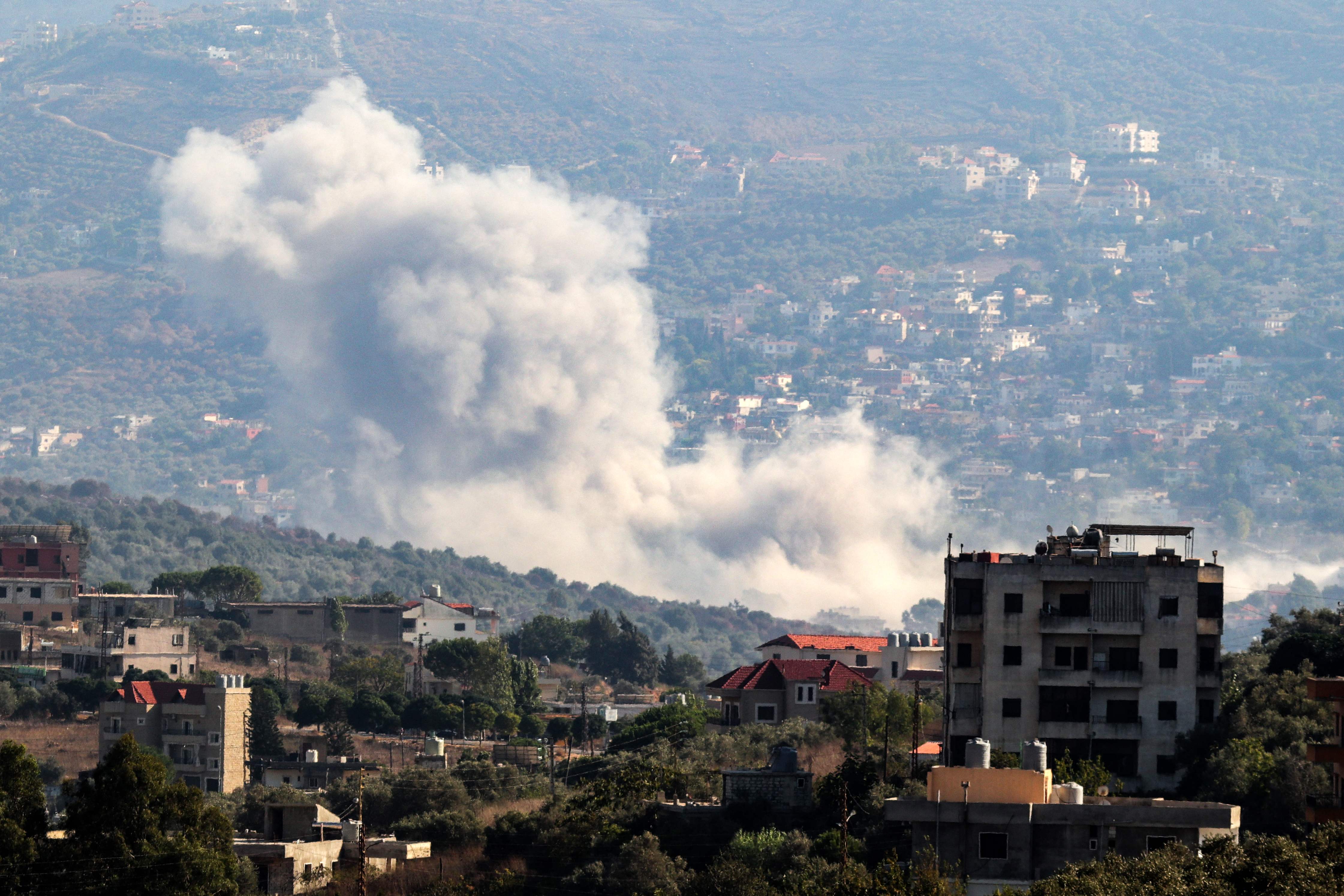 Smoke billows from the site of an Israeli strike that targeted the southern Lebanese village of Kfar Kila on August 21, 2024. (AFP)