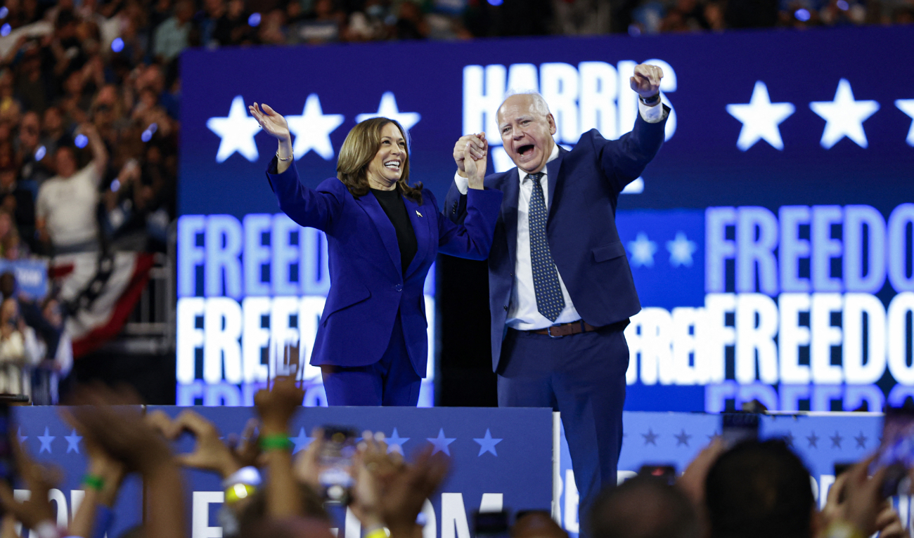 US Vice President and 2024 Democratic presidential candidate Kamala Harris and her running mate Minnesota Governor Tim Walz wave to the crowd after speaking at the campaign rally at the Fiserv Forum in Milwaukee, Wisconsin, August 20, 2024. (AFP)