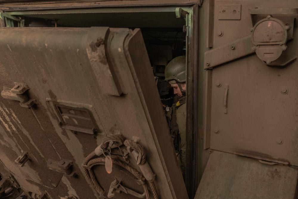 Ukrainian soldiers sit inside a US-made M113 armored personnel carrier as they depart for the front in the eastern Donetsk region on Aug. 5, 2024. (AFP)