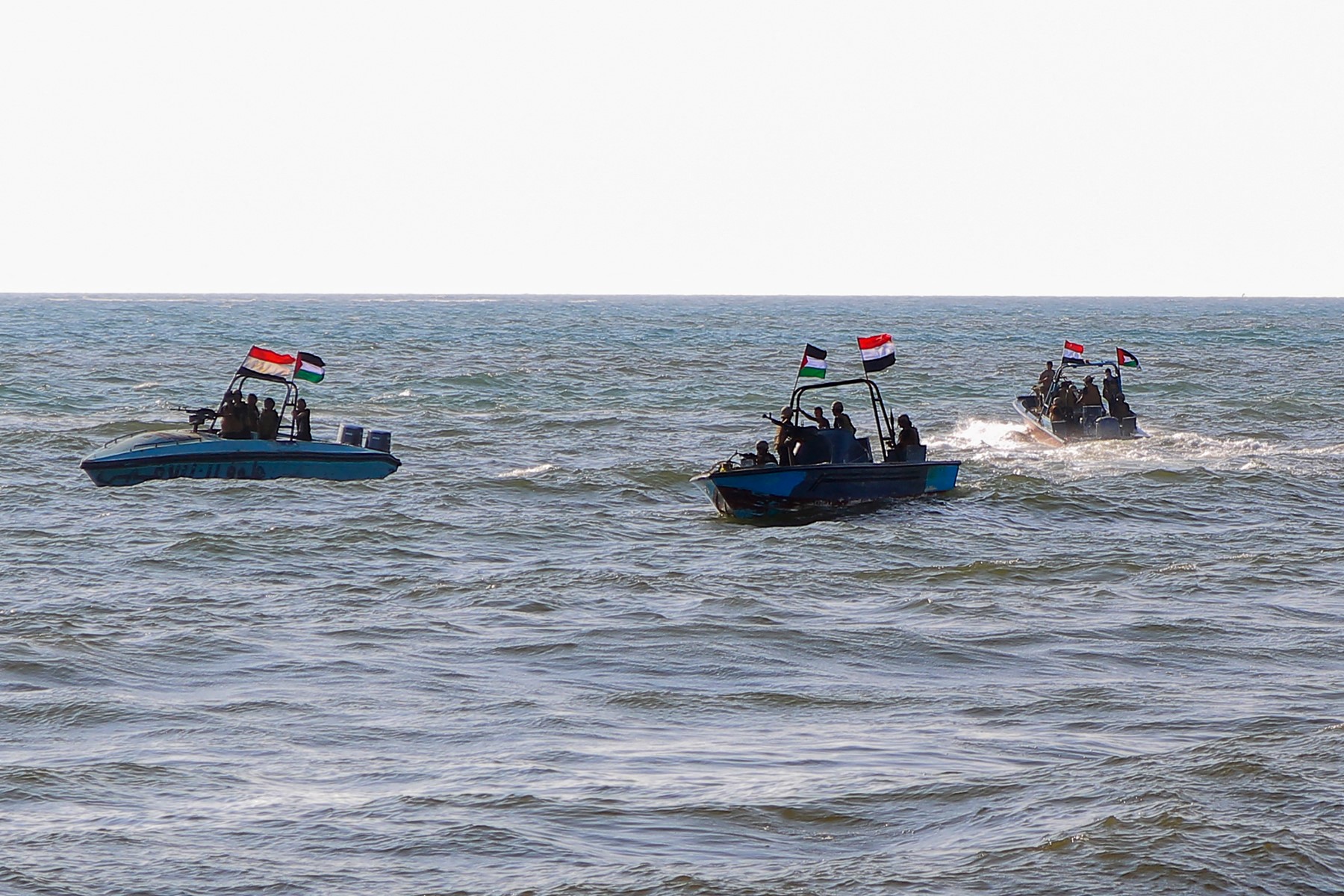 Members of the Yemeni Coast Guard affiliated with the Houthi group patrol the sea as demonstrators march through the Red Sea port city of Hodeida in solidarity with the people of Gaza on January 4, 2024(AFP)