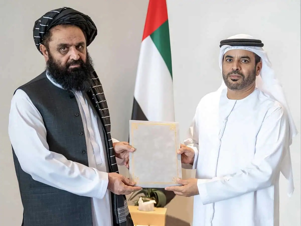 Mawlawi Badruddin Haqqani (left), Ambassador of the Islamic Emirate of Afghanistan to the United Arab Emirates, hands over a copy of his credentials to Assistant Undersecretary for Protocol at the Ministry of Foreign Affairs, Saif Abdullah Al-Shamsi, during a ceremony at the Ministry of Foreign Affairs of the United Arab Emirates on August 21, 2024. (@MoFA_Afg/X)