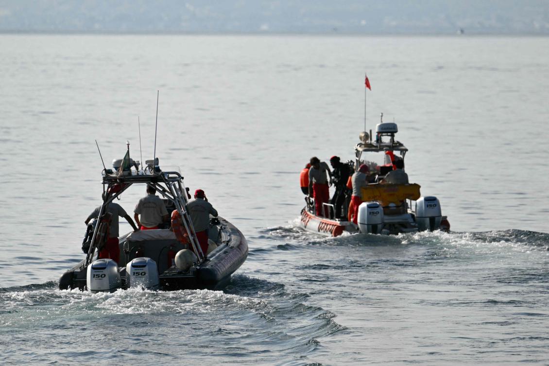 Divers leave Porticello harbor near Palermo on Aug. 23, 2024 to resume research for the last missing person aboard the British-flagged luxury yacht The Bayesian which sank off Sicily. (AFP)