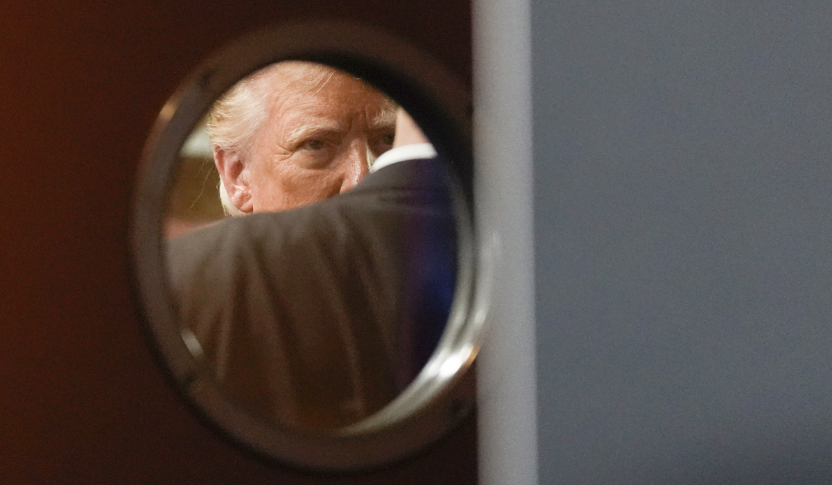 Republican presidential nominee former President Donald Trump is seen through a window in a door before speaking at a campaign event at ll Toro E La Capra, Friday, Aug. 23, 2024, in Las Vegas. (AP)