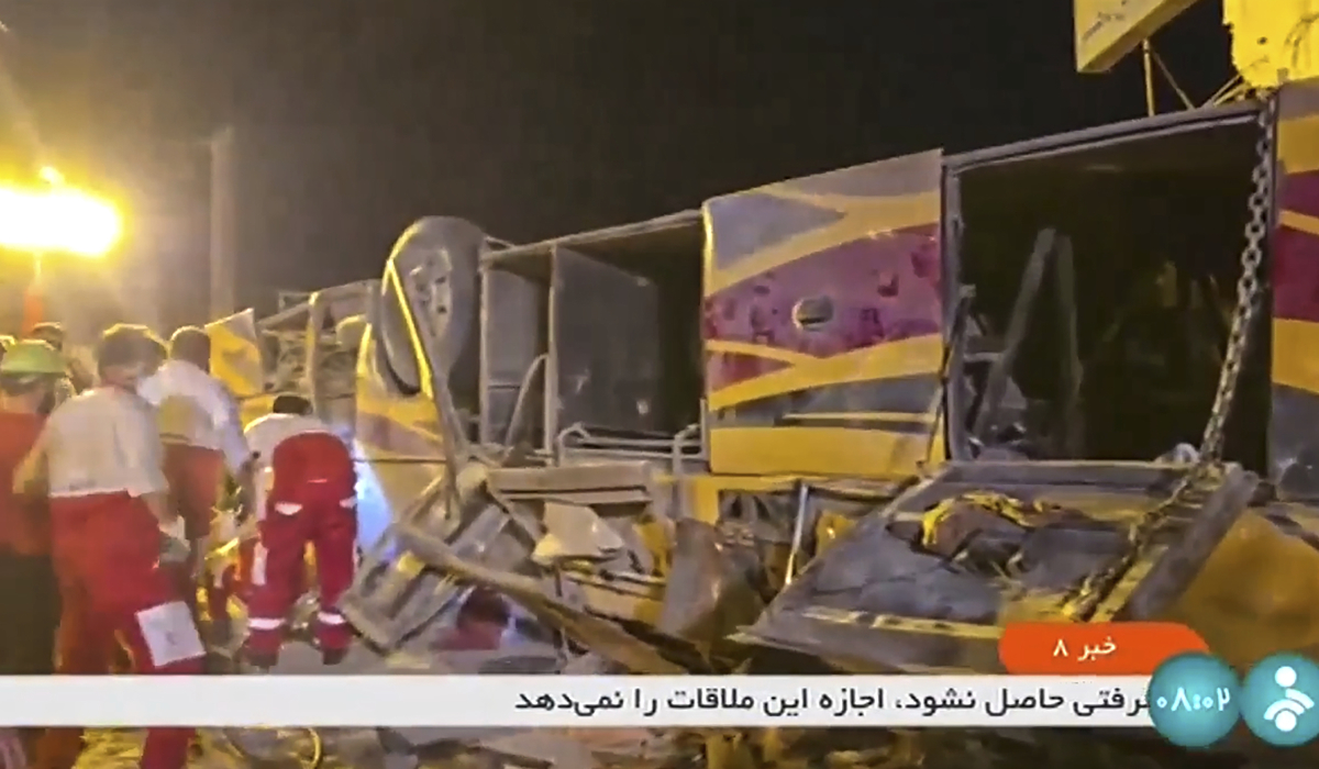 This image taken from a video released by Iranian state television shows the aftermath of a bus crash near Taft, Iran, early Wednesday, Aug. 21, 2024. (AP)