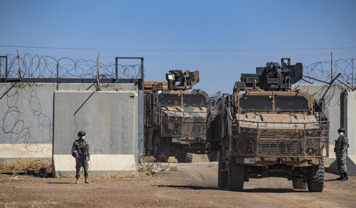 Turkish military vehicles enter Syria to take part in a joint patrol with Russian troops, in the countryside of the town of Derbassiye in Syria's northeastern Hasakeh province, on the border with Turkey, on July 14, 2021. (AFP)