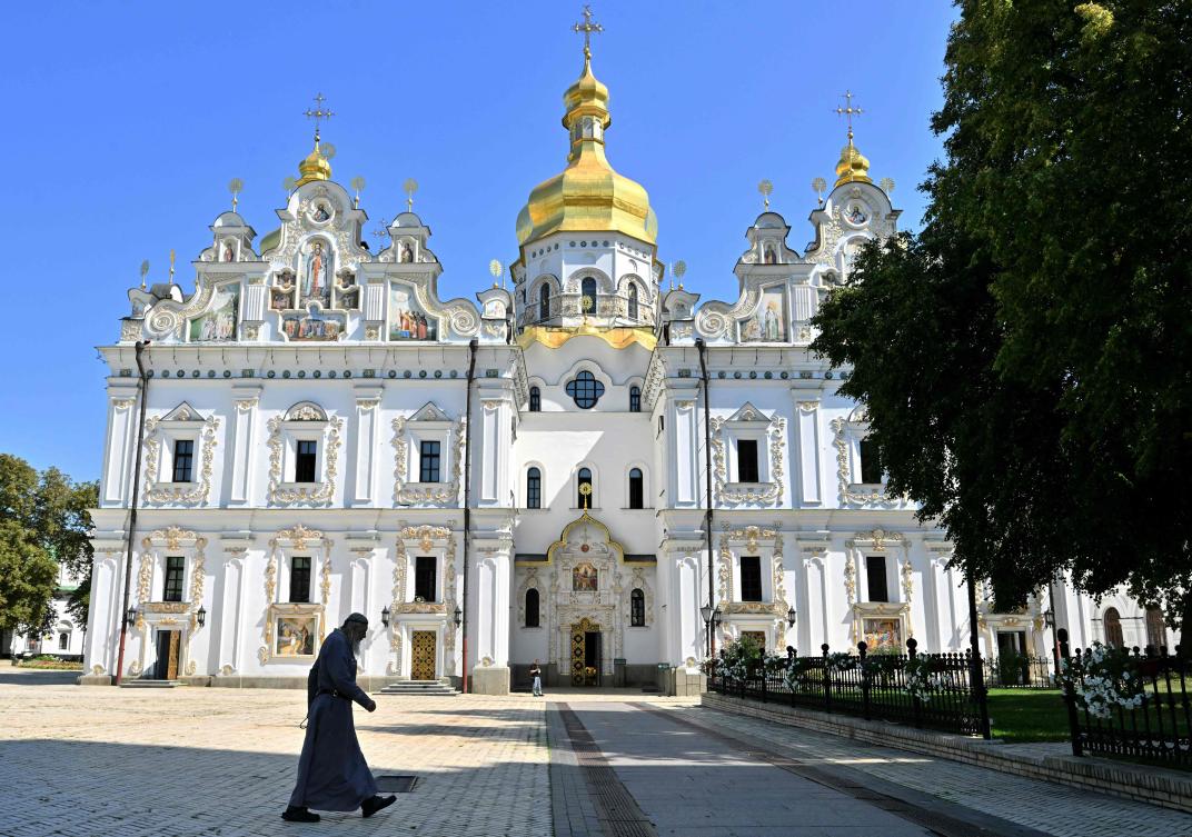 A monk walks past the Uspenskyi cathedral at Kyiv Pechersk Lavra in Kyiv on August 20, 2024. (AFP)