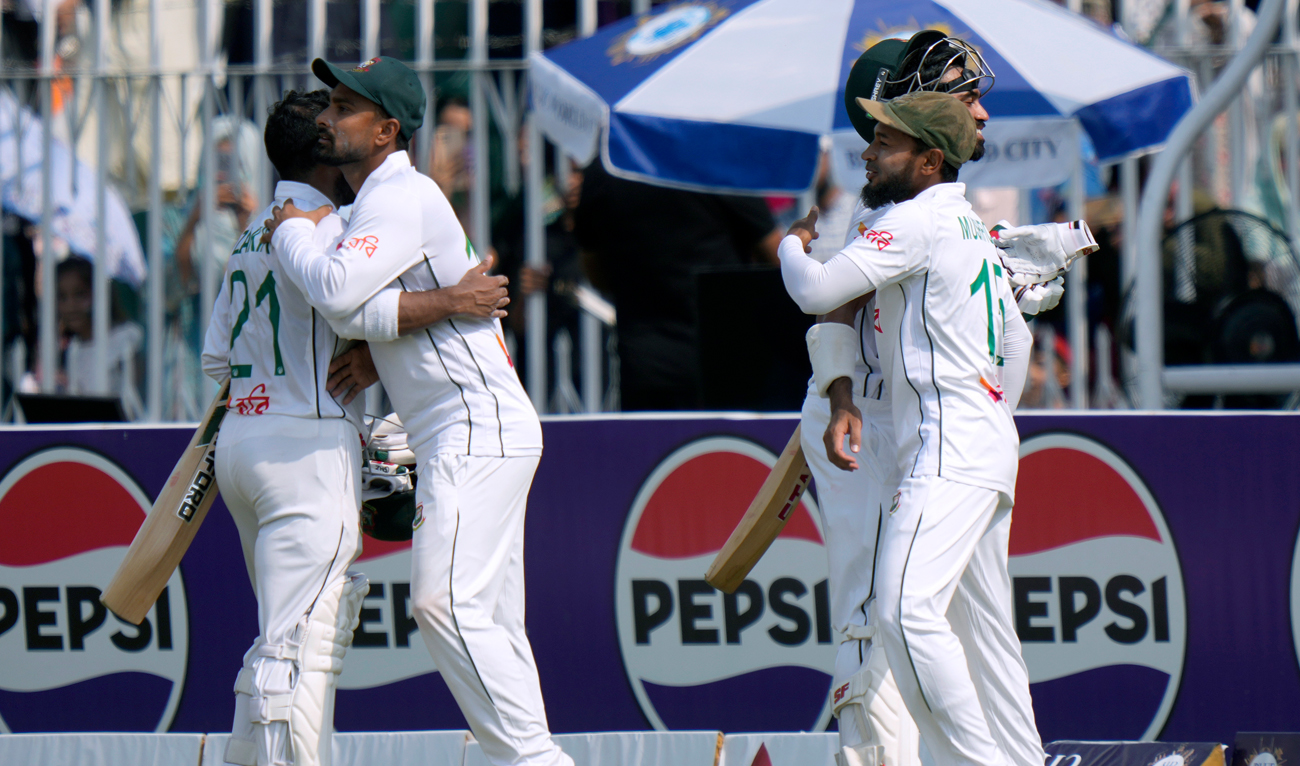 Bangladesh’s Shadman Islam, second right, and Zakir Hasan, left, are congratulated by teammates after winning first test cricket match against Pakistan, in Rawalpindi on August 25, 2024. (AP)