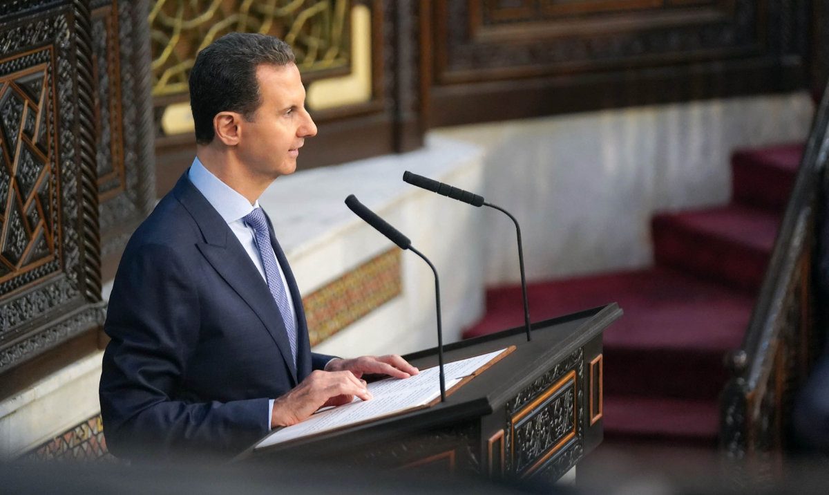 A handout picture released by the official Syrian Arab News Agency (SANA) on August 25, 2024, shows Syrian President Bashar Al-Assad addressing the country's parliament in Damascus as it opens a new legislative term. (AFP)