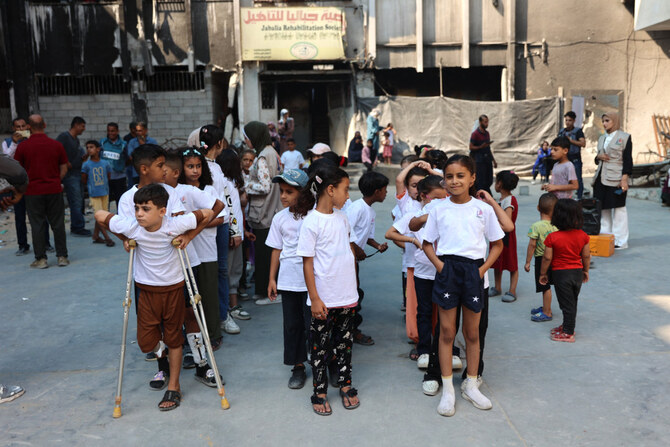 Palestinian children attend a recreational summer 'Hope Camp' for orphaned children, which is supported by Americans for Palestinian Children, at the Jabalia Rehabilitation Society in the Jabalia refugee camp in the northern Gaza Strip on July 27, 2024. (AFP)