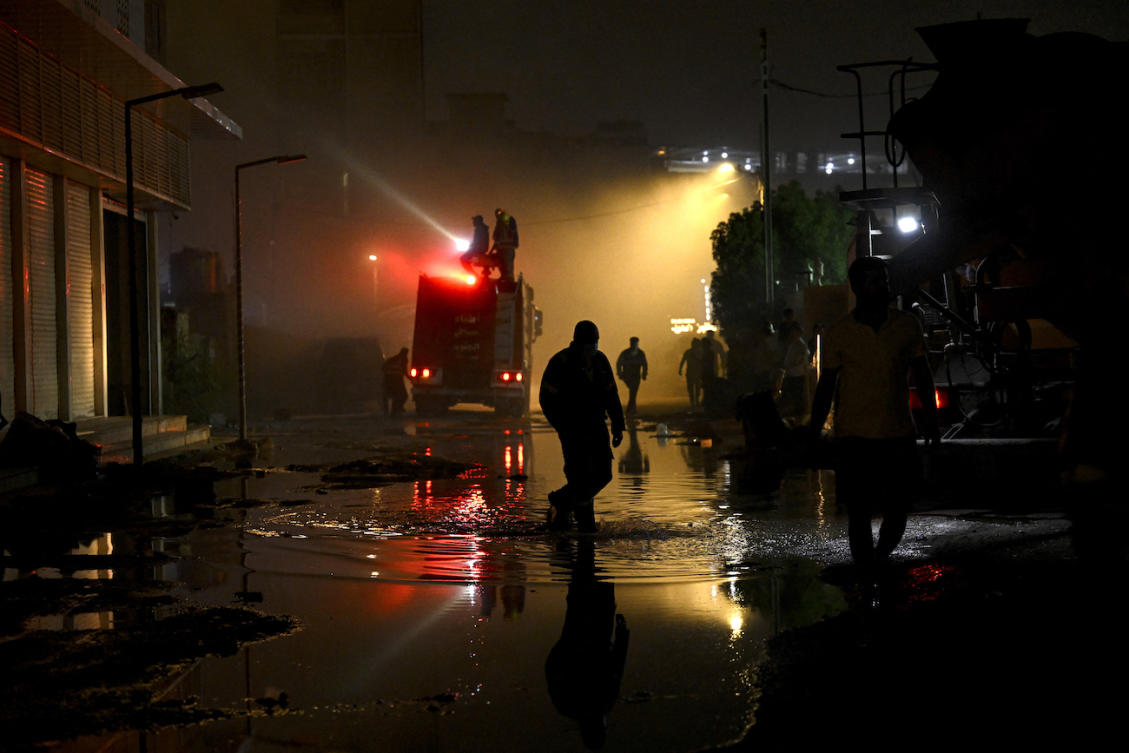 The fire broke out in a parking area for the Parviz Khan border crossing that connects the autonomous Kurdistan region with Iran. (File/AFP)