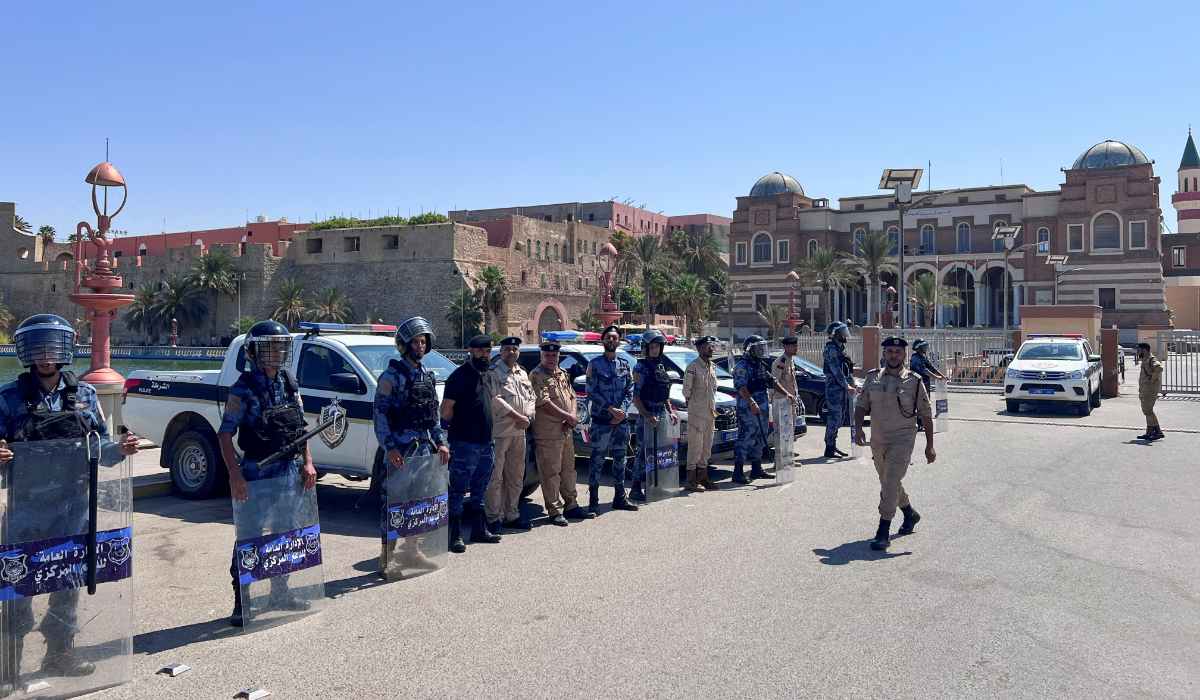 Libyan Ministry of Interior personnel stand guard in front of the Central Bank of Libya in Tripoli, Libya, August 26, 2024. (Reuters)