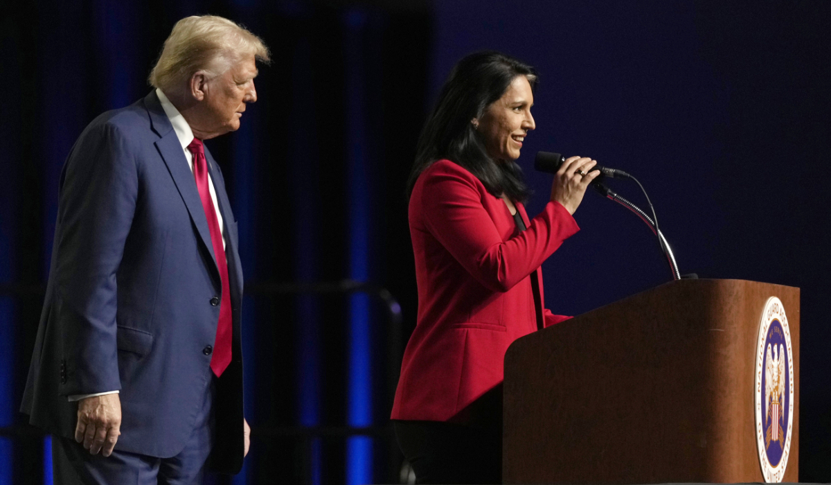 Republican presidential nominee former President Donald Trump, left, looks on as former Rep. Tulsi Gabbard of Hawaii, speaks at the National Guard Association of the United States' 146th General Conference, Monday, Aug. 26, 2024, in Detroit. (AP)