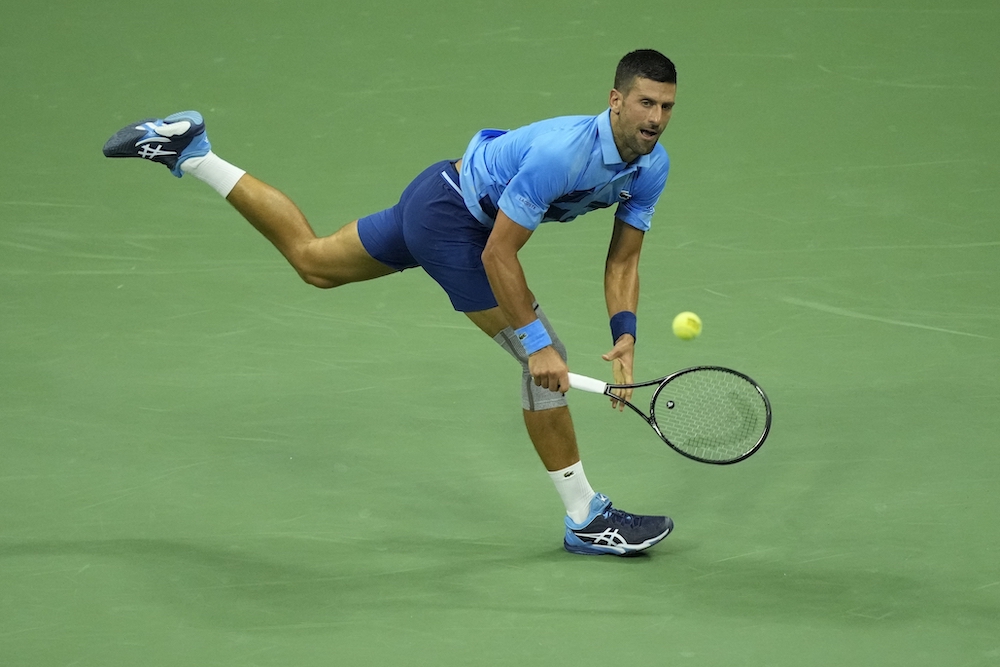 Novak Djokovic, of Serbia, returns a shot to Radu Albot, of Moldova, during a first round match of the US Open tennis championships Monday in New York. (AP)