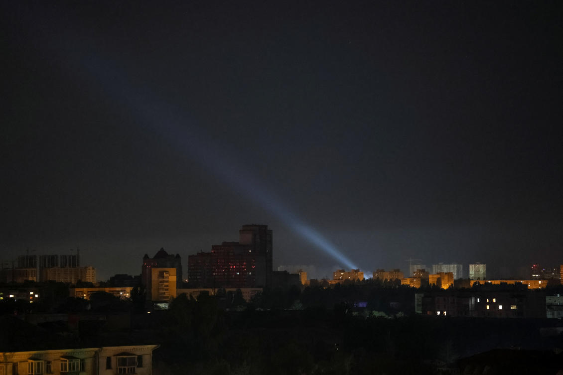 Ukrainian service personnel use a searchlight as they search for drones in the sky over the city during a Russian drone strike, amid Russia's attack on Ukraine, in Kyiv, Ukraine August 27, 2024. (Reuters)