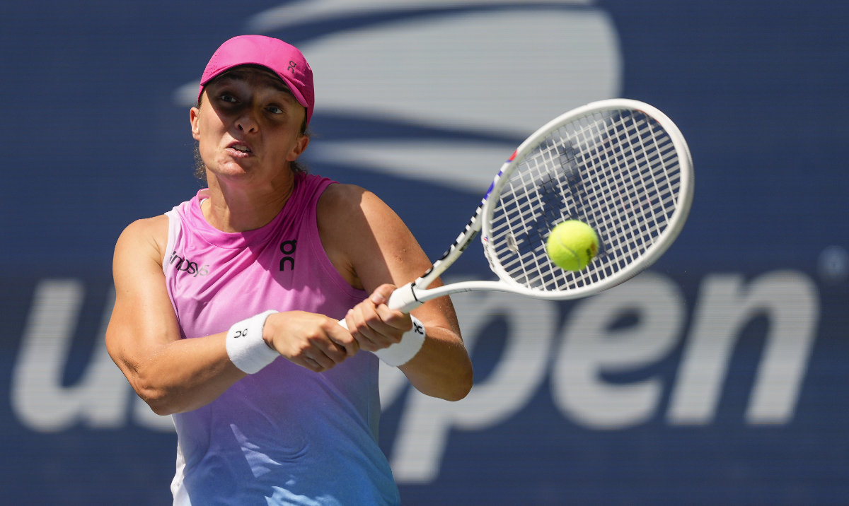 Iga Swiatek, of Poland, returns a shot to Kamilla Rakhimova, during the first round of the U.S. Open tennis championships, Tuesday, Aug. 27, 2024, in New York. (AP)