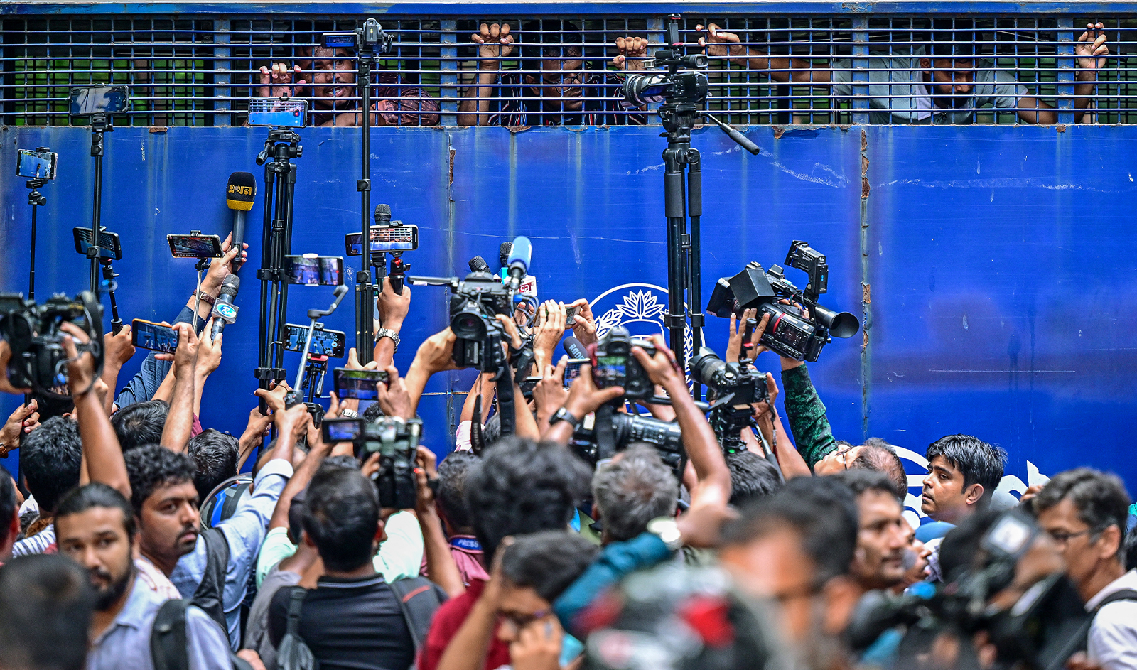 rotesters are being detained in a police van while protesting outside the High Court building as they demand justice for the victims arrested and killed in the recent countrywide violence in Dhaka on July 31, 2024. (AFP)