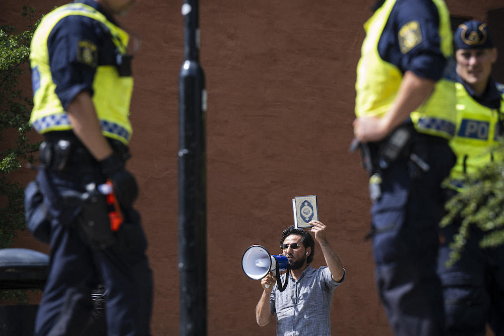 Salwan Momika, a Christian Iraqi, protests outside a mosque in Stockholm on June 28, 2023. (AFP)