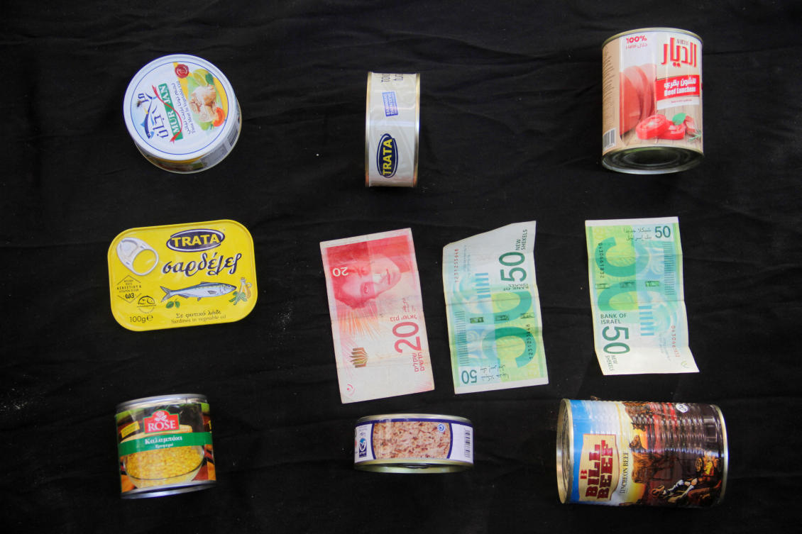 Canned products are displayed with 120 NIS ($32.81) illustrating how much they are worth in the local market in north Gaza, amid a hunger crisis and soaring prices, in this illustration taken August 25, 2024. (Reuters)