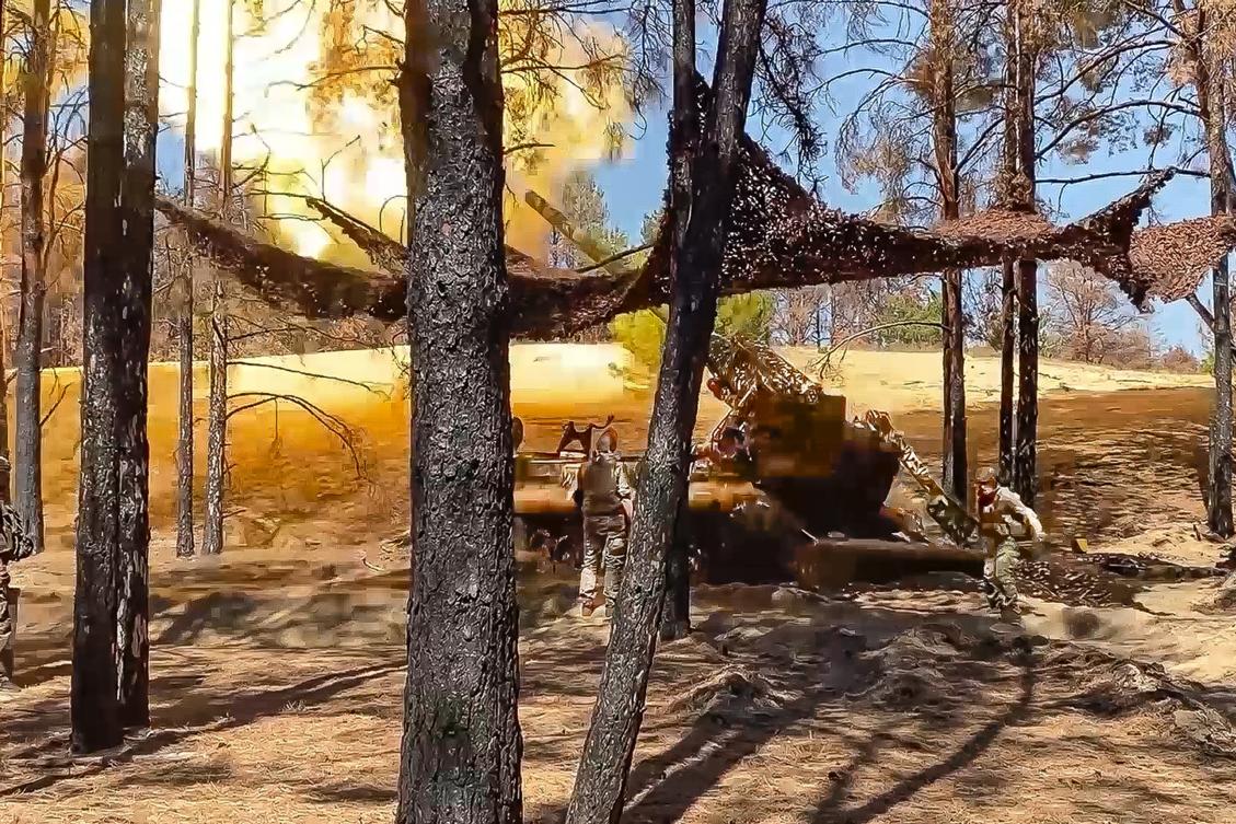 Above, Russian soldiers fire from a 203-mm self-propelled gun toward Ukrainian positions in an undisclosed location in Ukraine. (Russian Defense Ministry Press Service via AP)