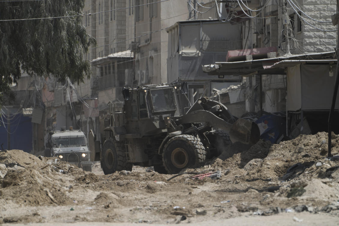 A bulldozer from the Israeli forces moves on a street during a military operation in the West Bank refugee camp of Nur Shams, Tulkarem, Thursday, Aug. 29, 2024. (AP)