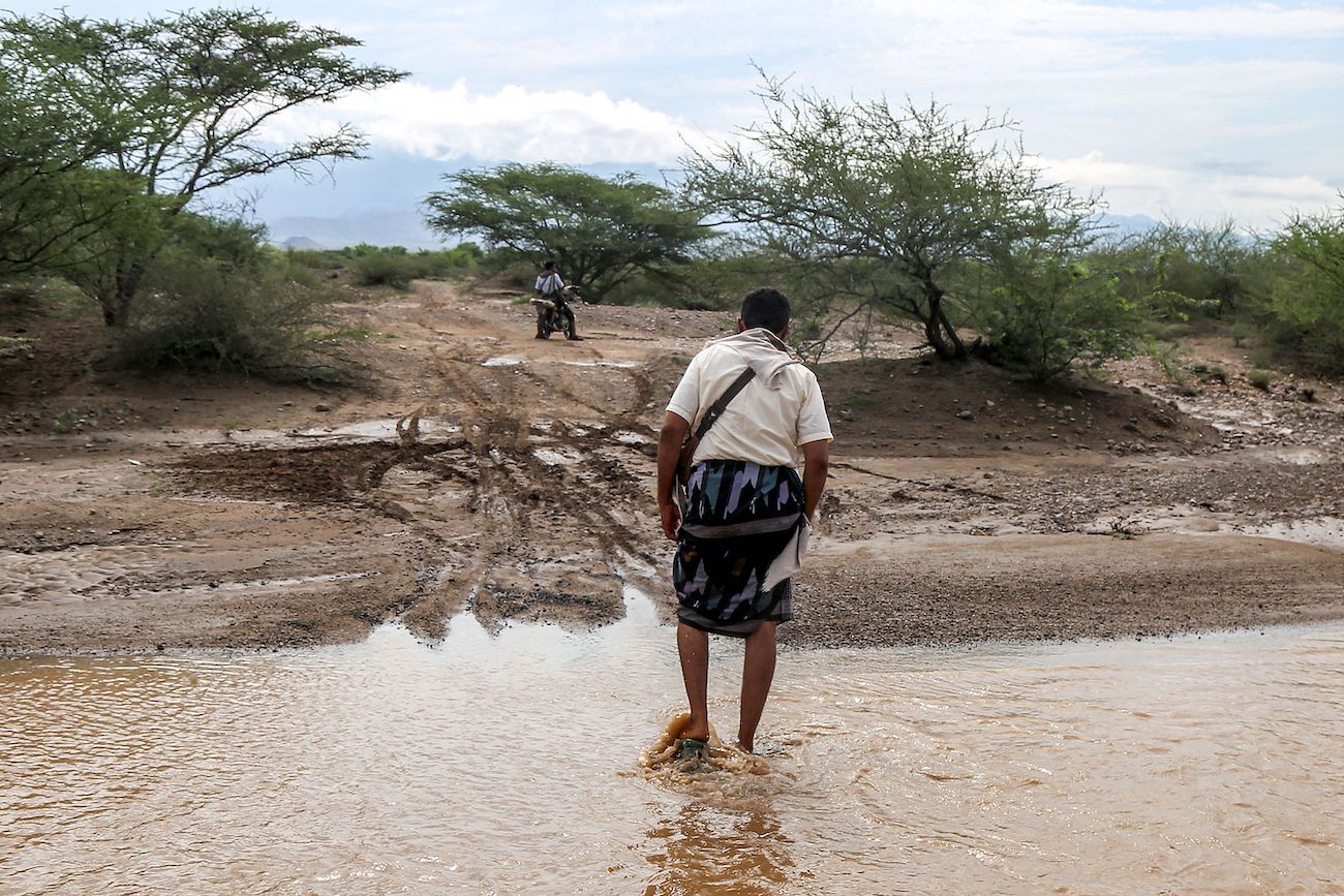 A man walks out of a flooded area following recent heavy flooding in the Hays region south of Yemen’s Hodeidah province on August 28, 2024. (AFP)