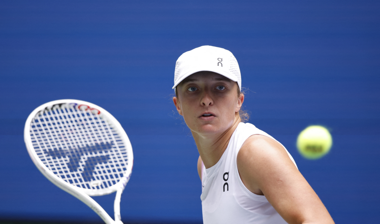 Poland's Iga Swiatek hits a return to Ena Shibahara of Japan during their women's singles second round tennis match on day four of the US Open tennis tournament at the USTA Billie Jean King National Tennis Center in New York City, on August 29, 2024. (AFP)