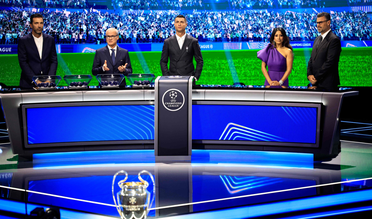 Italy ex-goalie Gianluigi Buffon, UEFA Deputy General Secretary Giorgio Marchetti, Portugal national team player and Saudi club Al-Nassr's forward Cristiano Ronaldo, British journalist Reshmin Chowdhury and UEFA Communications managing director Pedro Pinto during ceremony of the draw for the 2024-2025 Champions League group stage. (AFP)