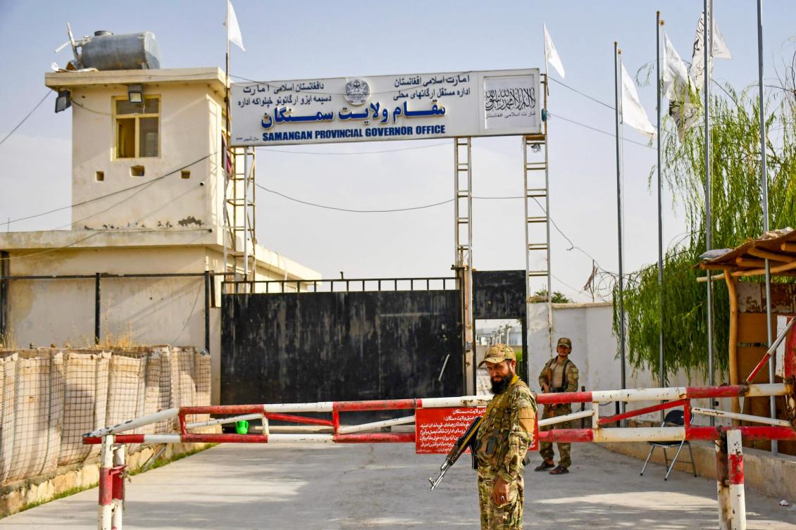An Afghan security personnel stands guard at Samangan Provincial Governor office in Aybak on August 28, 2024. (AFP)