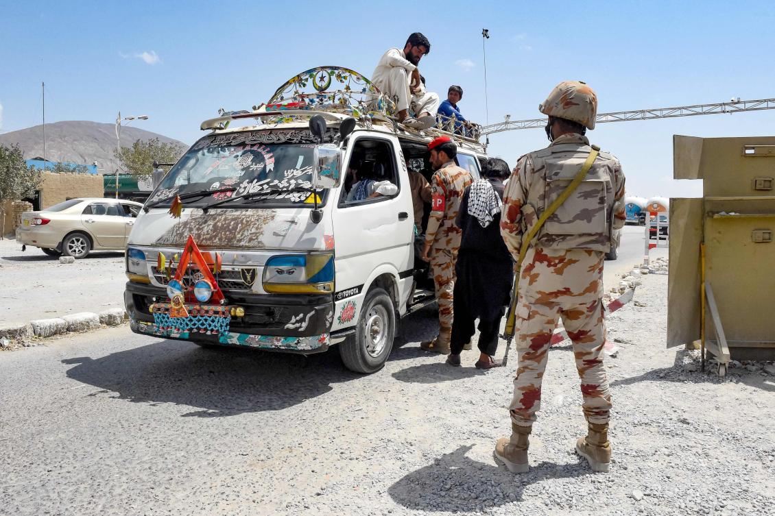 Pakistan’s paramilitary rangers inspect a passenger van at a checkpoint a day after attacks by separatist militants on the outskirts of Quetta on Aug. 27, 2024. (AFP)