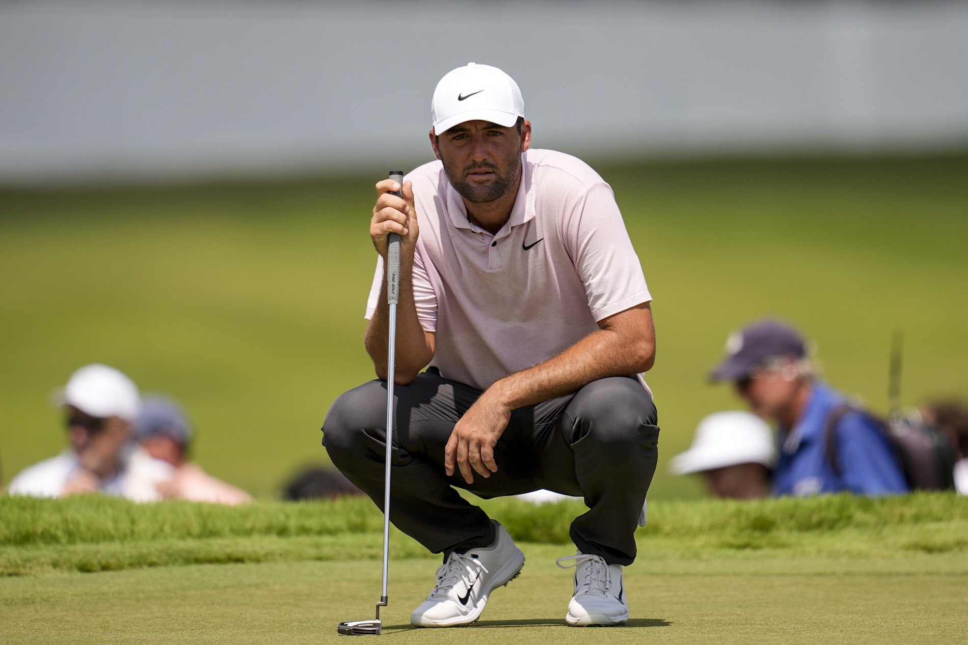 Scottie Scheffler lines up a putt on the fifth green during the second round of the Tour Championship golf tournament Friday in Atlanta. (AP)