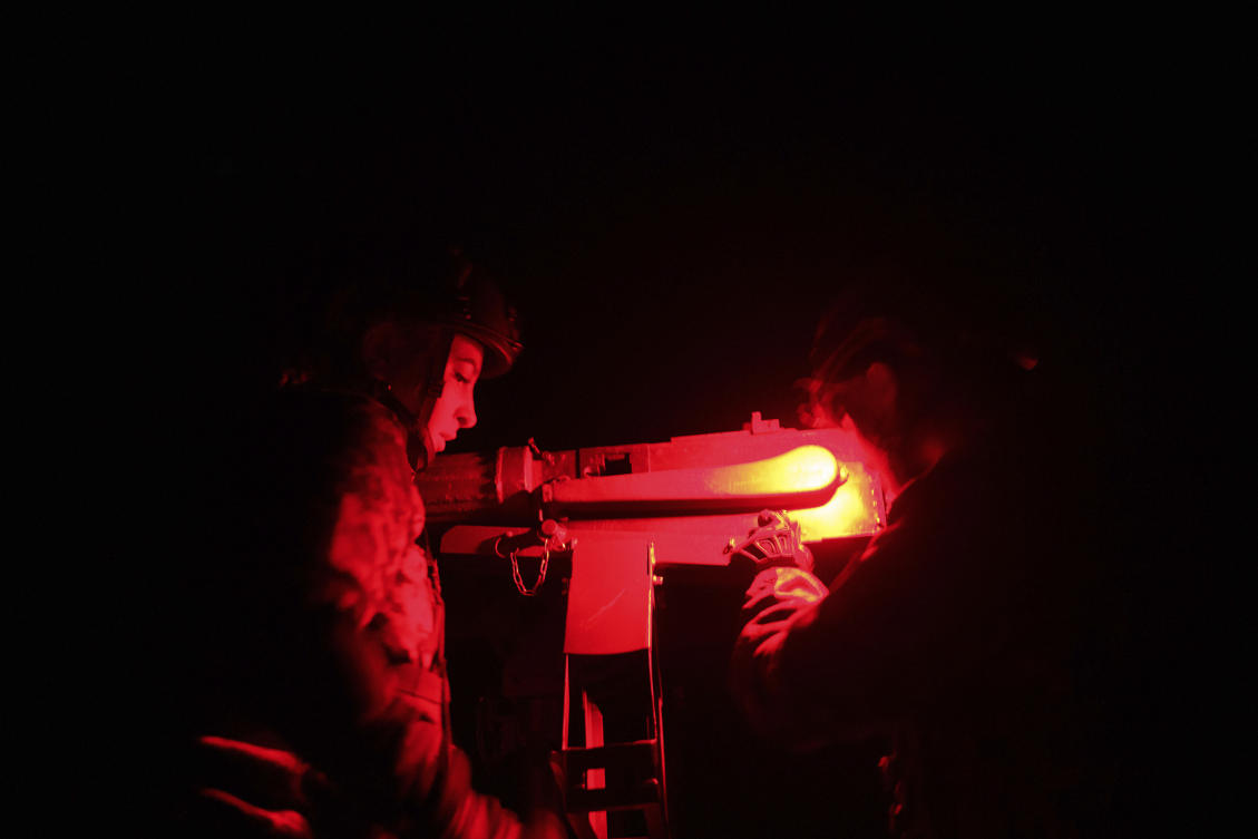 Volunteers for an air-defense unit prepare a machine gun near Bucha, Kyiv region, Ukraine, Aug. 9, 2024. (AP Photo/Evgeniy Maloletka)
