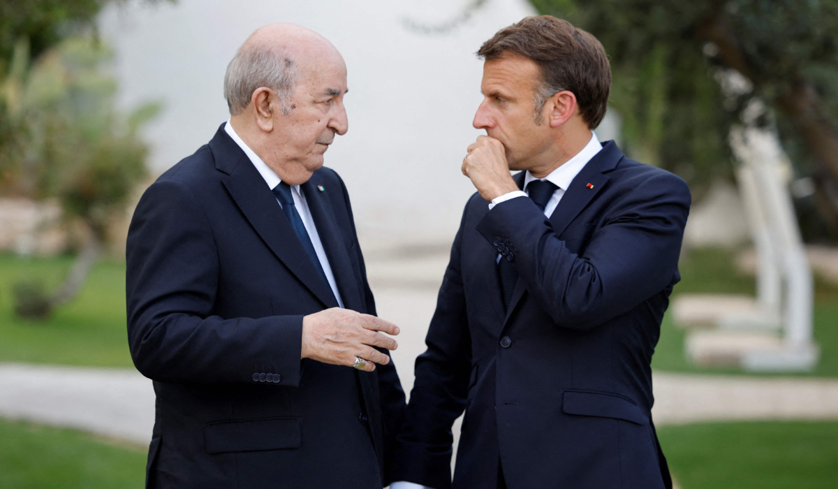 France's President Emmanuel Macron (R) talks with Algeria's President Abdelmadjid Tebboune (L) as they attend the G7 Summit hosted by Italy at the Borgo Egnazia resort in Savelletri on June 13, 2024. (AFP)