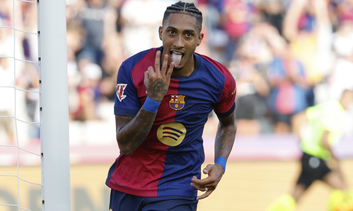 Barcelona's Raphinha celebrates scoring his side's 5th goal during the Spanish La Liga soccer match between FC Barcelona and Valladolid at the Olympic stadium in Barcelona, Spain, Saturday, Aug. 31, 2024. (AP)