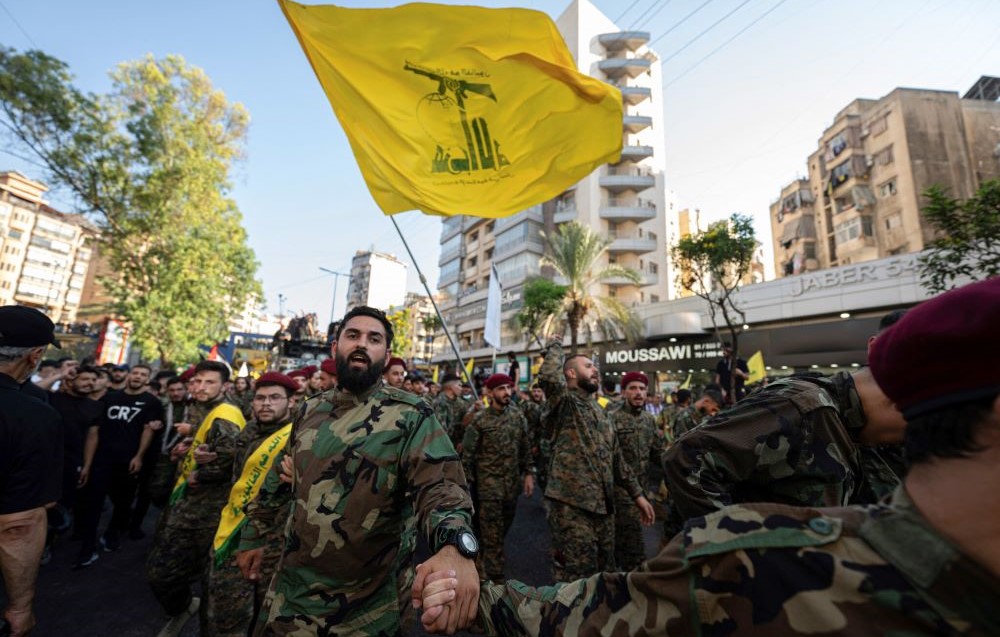 Hezbollah members during the funeral procession of commander Fuad Shukr in Beirut's southern suburbs, Aug. 1, 2024. (AFP)