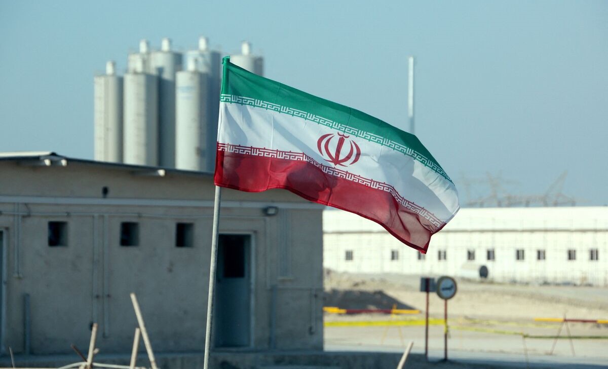 The Iranian flag flies in front of Bushehr nuclear power plant, Nov. 10, 2019. (AFP)