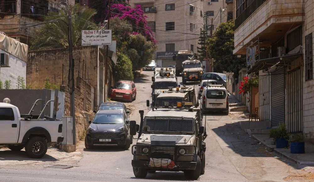 Israeli military vehicles during a raid in Nablus, occupied West Bank, Aug. 19, 2024. (AFP)