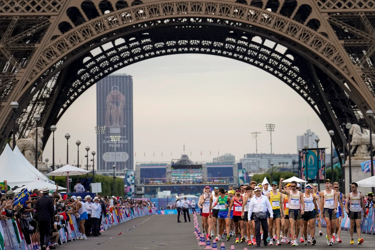 Fans cheer as athletes line up to start the men's 20km race walk at the 2024 Summer Olympics Thursday in Paris. (AP)